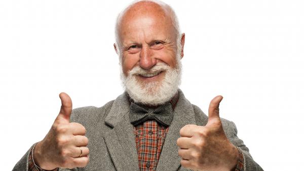 Old man with a big beard and a smile on white background