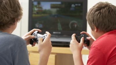 Two Boys Playing With Game Console