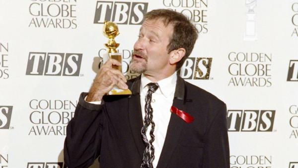 (FILES) A file picture taken on January 22, 1994 in Beverly Hills, shows US actor Robin Williams posing with his best actor in a musical or comedy award during the Golden Globe ceremony. Oscar-winning actor and comedian Robin Williams was found dead at hi